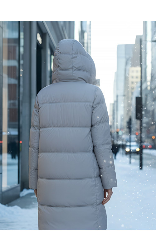 Длинный женский пуховик с капюшоном для зимы.